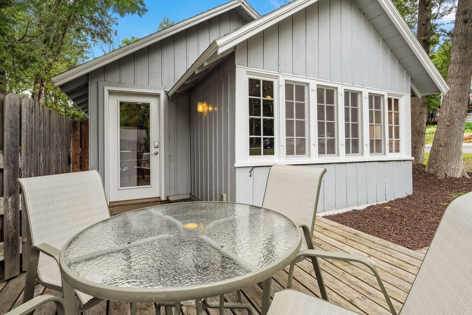 Cute front porch includes a patio set