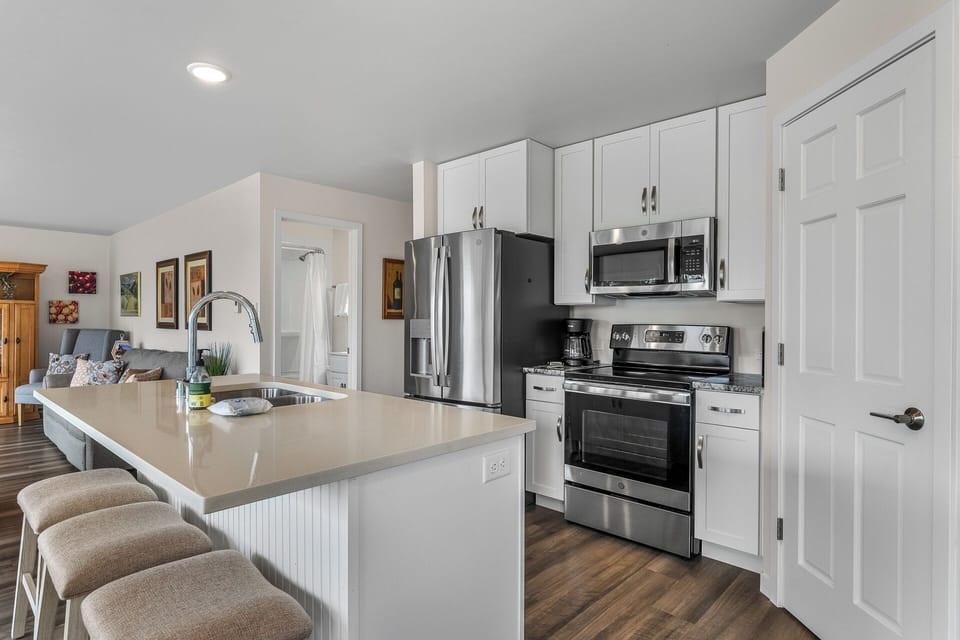 Full stocked kitchen with stainless steel appliances
