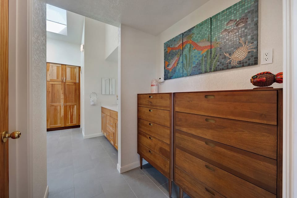 Ample storage in the corridor between the primary suite and the priviate ensuite bath.