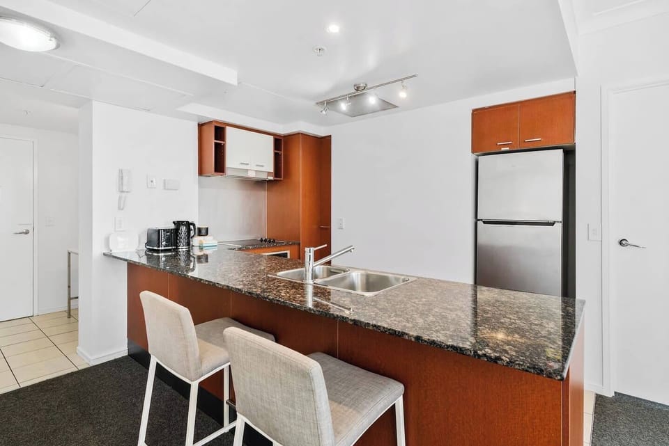 Whip up a delicious meal in the modern kitchen, fully equipped with stainless steel appliances and all the cooking essentials.