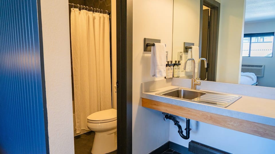 Freshen up with bright vanity space and hotel-style amenities.