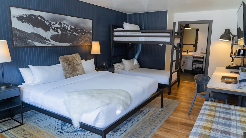 Stretch out with friends in this airy, modern bunk suite.