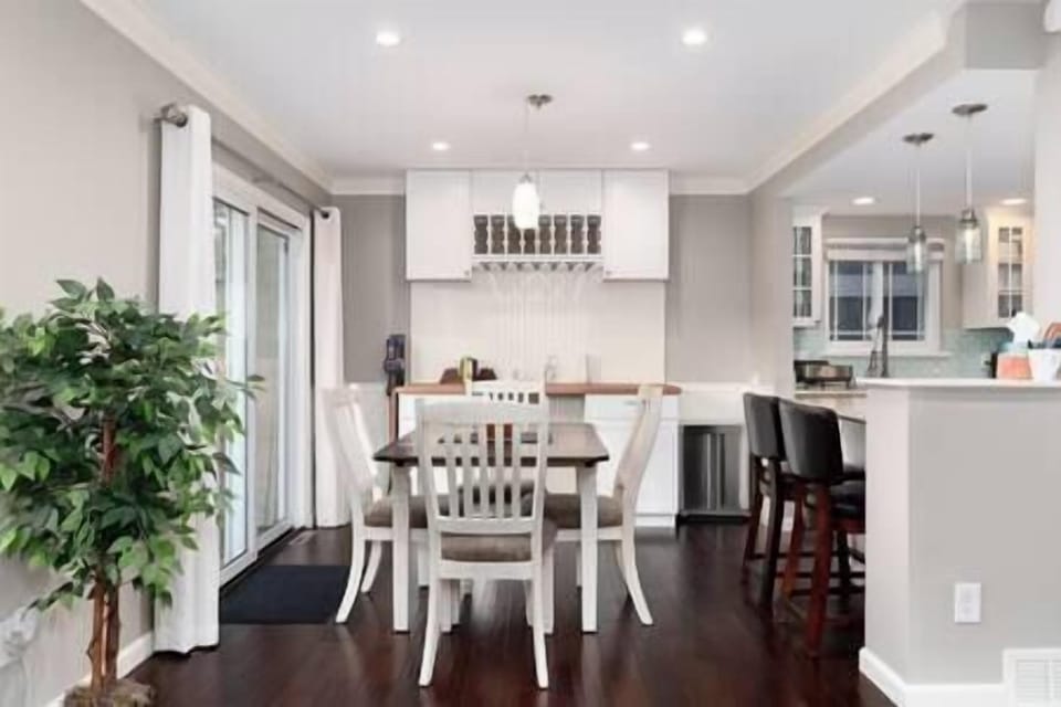 The dining table seats four and there is seating for another two at the counter.