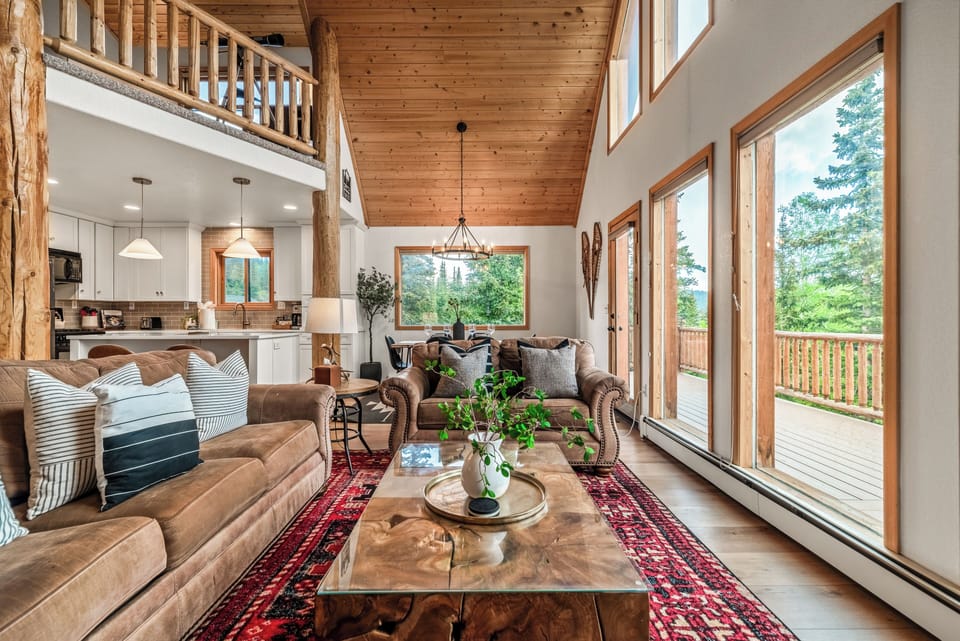 As you enter the home, you are greeted by the floor to ceiling windows of the Great Room