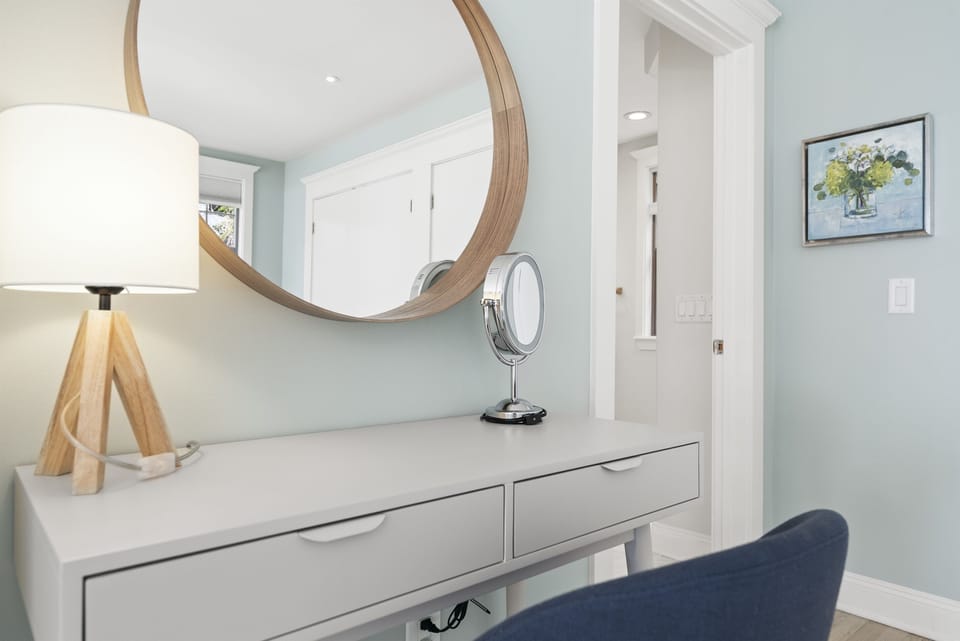 Bright hallway with warm accents leading to beautiful bedrooms and living spaces.