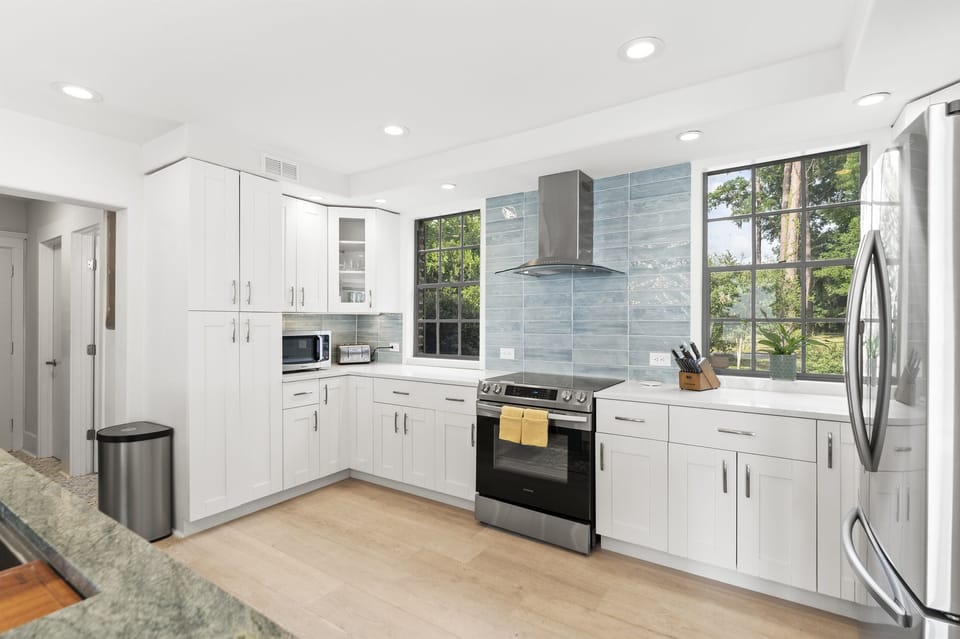 A beautifully updated chef-style kitchen with modern finishes, premium appliances, and an open layout perfect for cooking and gathering.