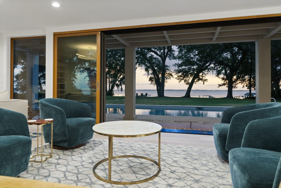 Slider opens all the way for seamless indoor-outdoor living. Enjoy the breeze, sunlight, and stunning river views right from the comfort of your seat.