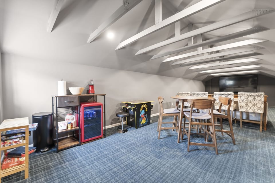 Spacious game and entertainment room with everything you need for a fun night in.