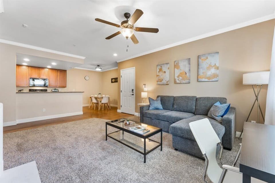 The sofa pulls out into a sleeping area for two, with bedding and pillows provided. 