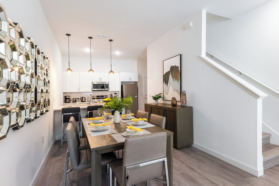 Gather and enjoy a delicious meal in this chic and bright dining area.