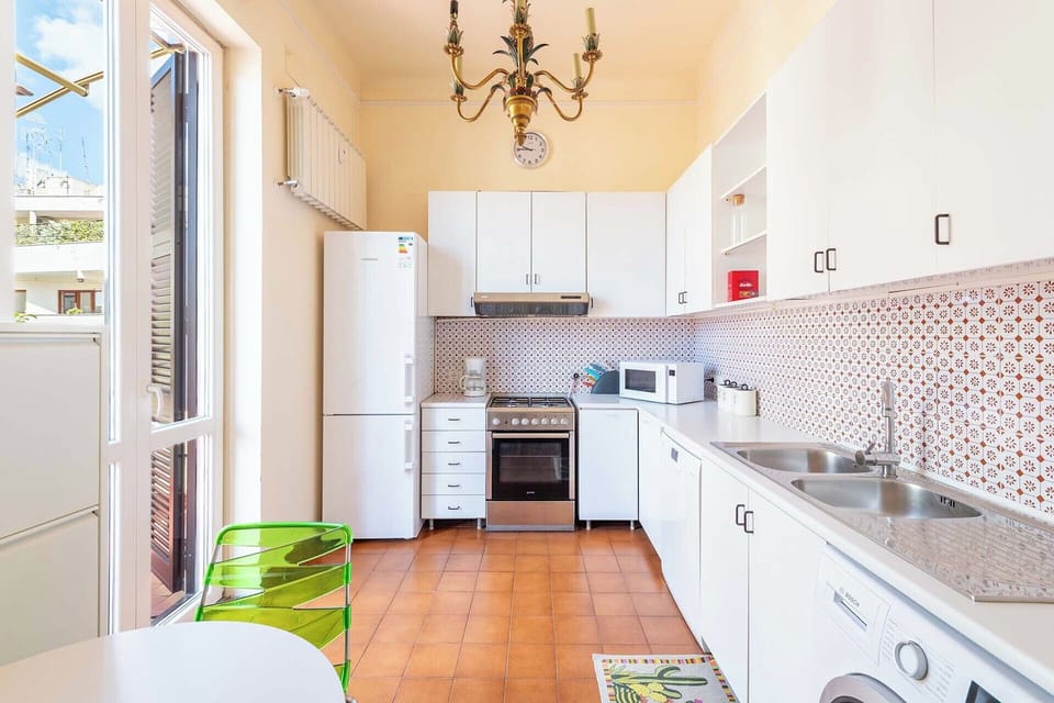 Large kitchen opens to the second terrace.