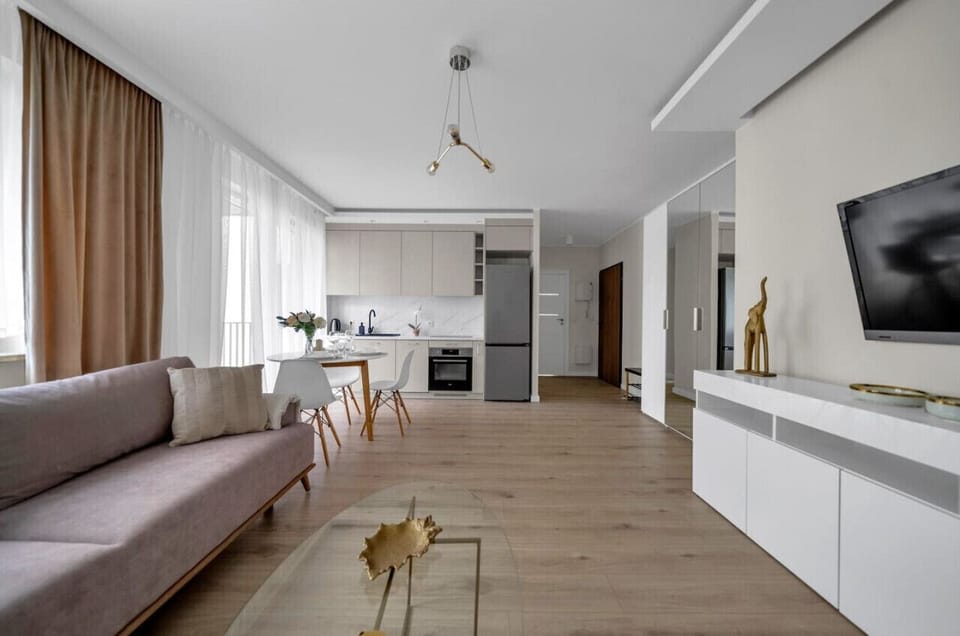 Comfortable Living Room with Sofa Bed and Smart TV | Book Now with RENTUJEMY