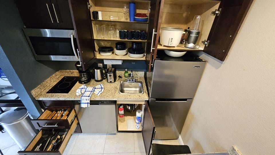 Fully stocked with the basics to whip up a home-style meal. Appliances: Coffee m