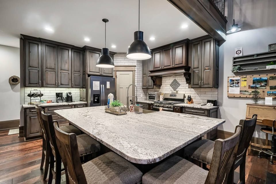 This fully equipped kitchen features a spacious island, perfect for meal prep and entertaining.