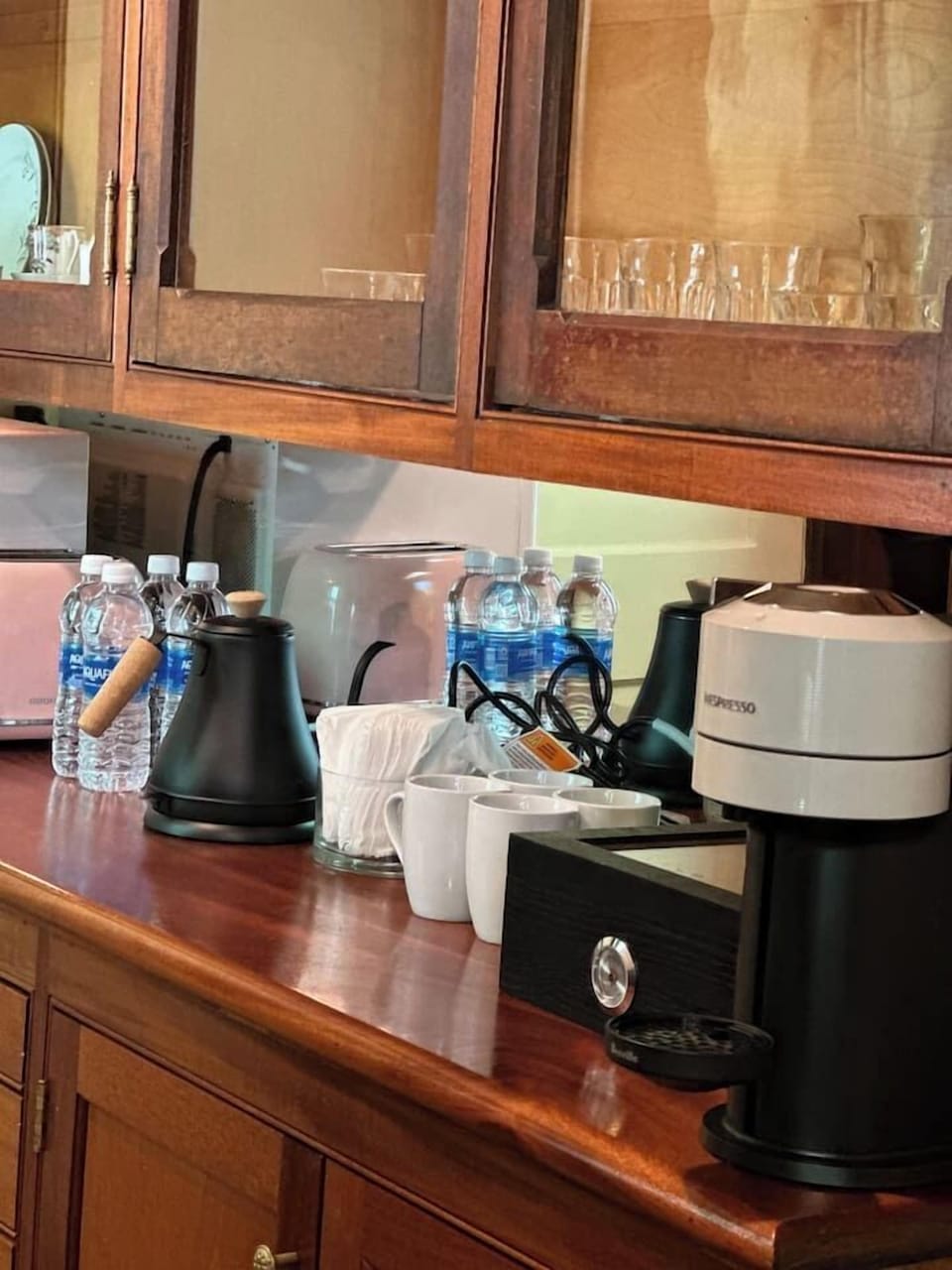 Coffee bar setup with Keurig machine and tea selection.