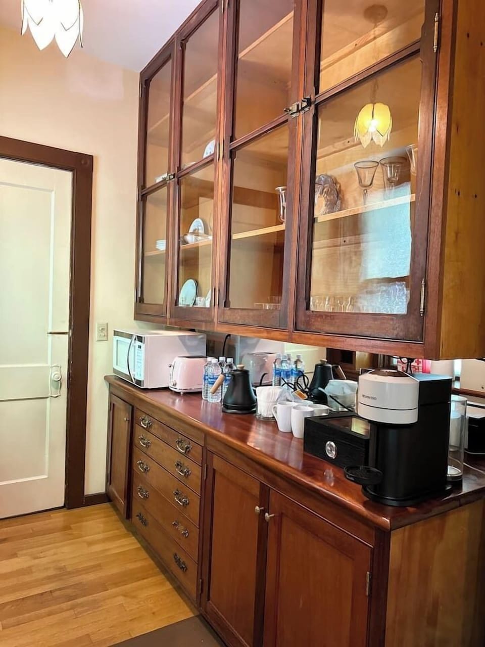 Coffee bar setup with Keurig machine and tea selection.