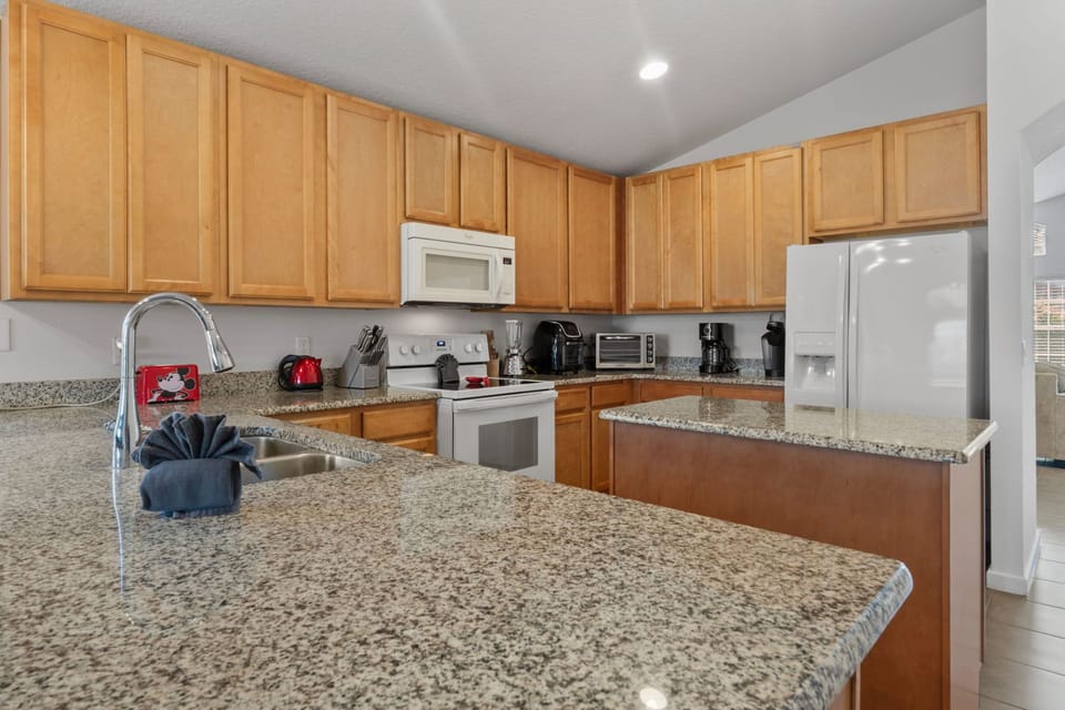 Ample storage space in kitchen fully equipped for all your vacation needs