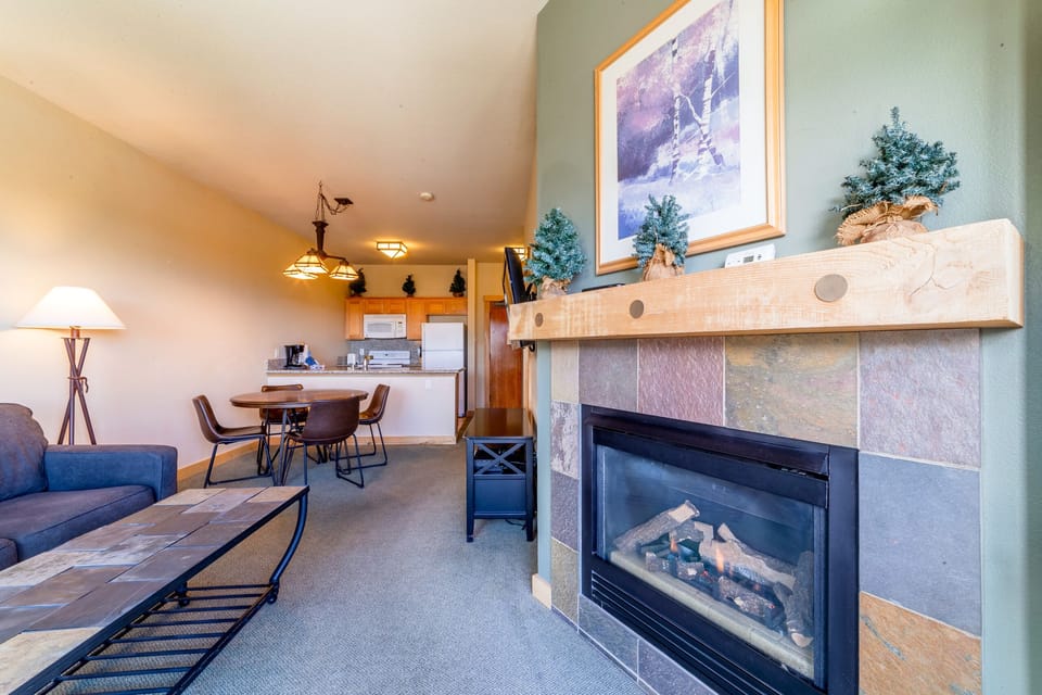 Living room has beautiful gas fireplace.