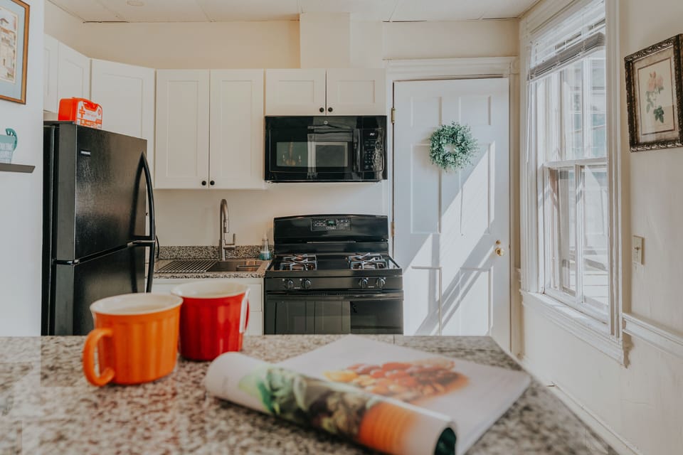 Bright, fully equipped kitchen with warm morning light