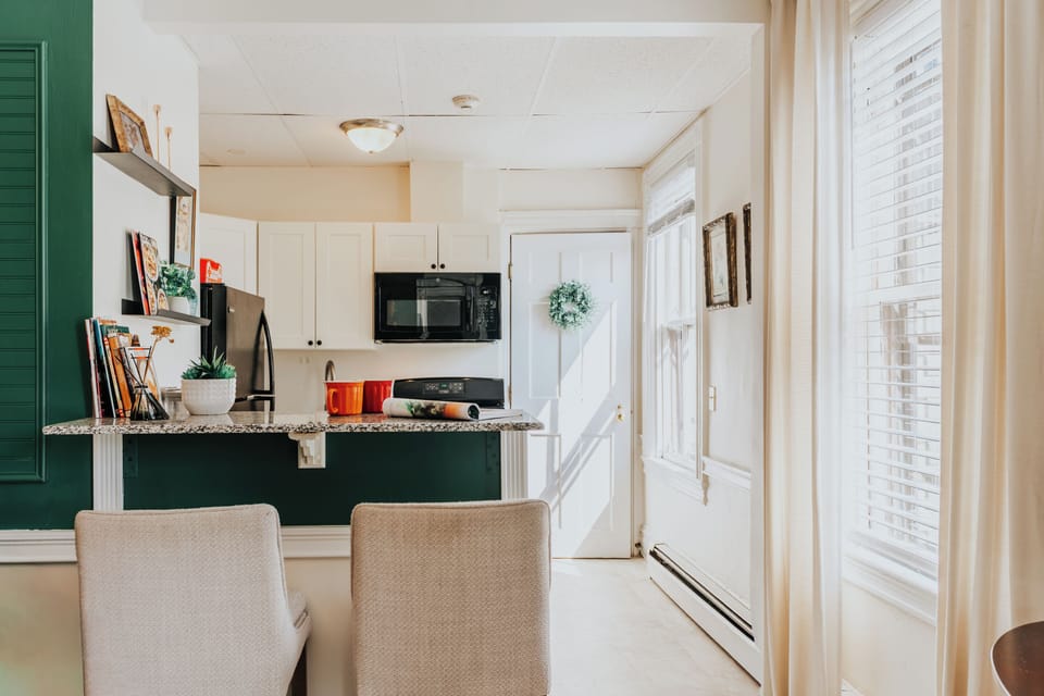 Bright, fully equipped kitchen with warm morning light