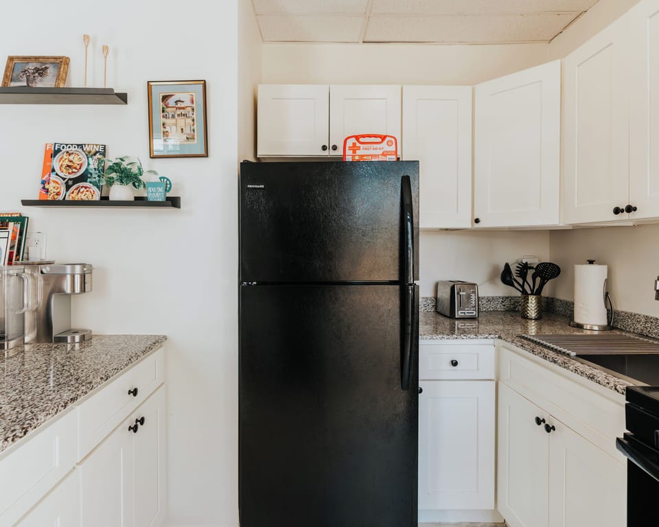 Elegant white cabinets and modern appliances