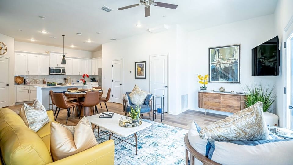 Kick back in a stylish, open-concept living space designed for comfort and connection. Whether you're debriefing after a Rangers game, watching pre-game coverage on the smart TV or just relaxing with your crew—The Ryan's living area has you covered.