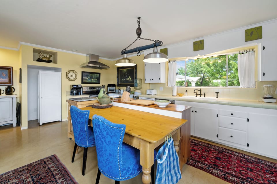 
expansive kitchen that doubles as a work area!