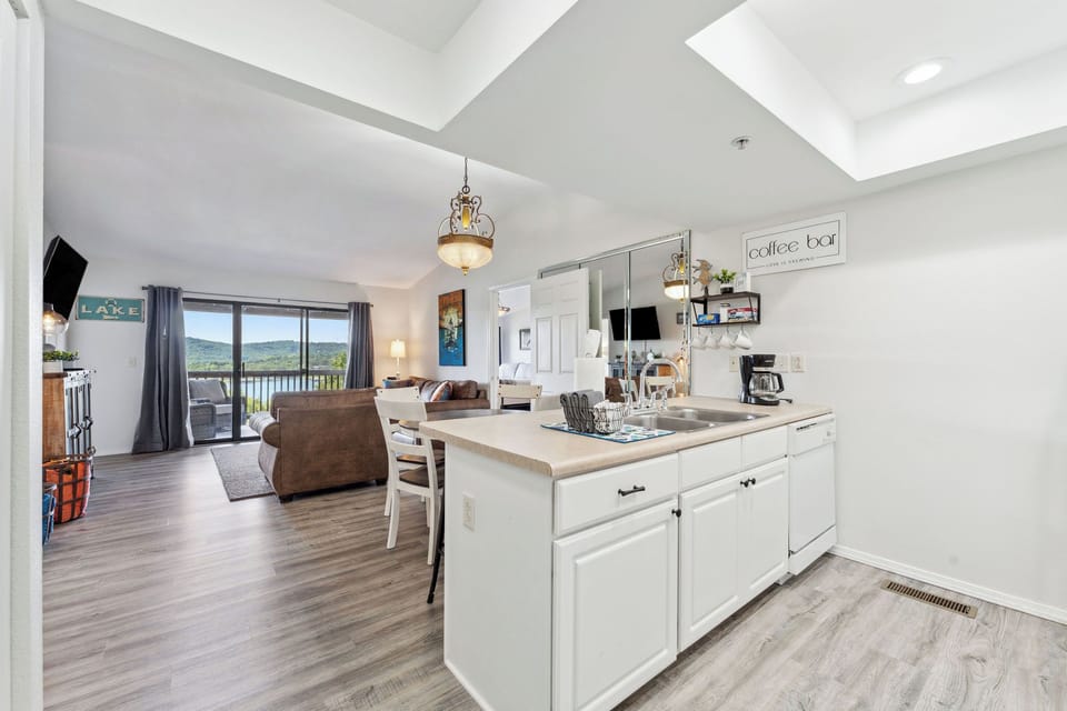 Open layout connecting kitchen, dining, and living spaces