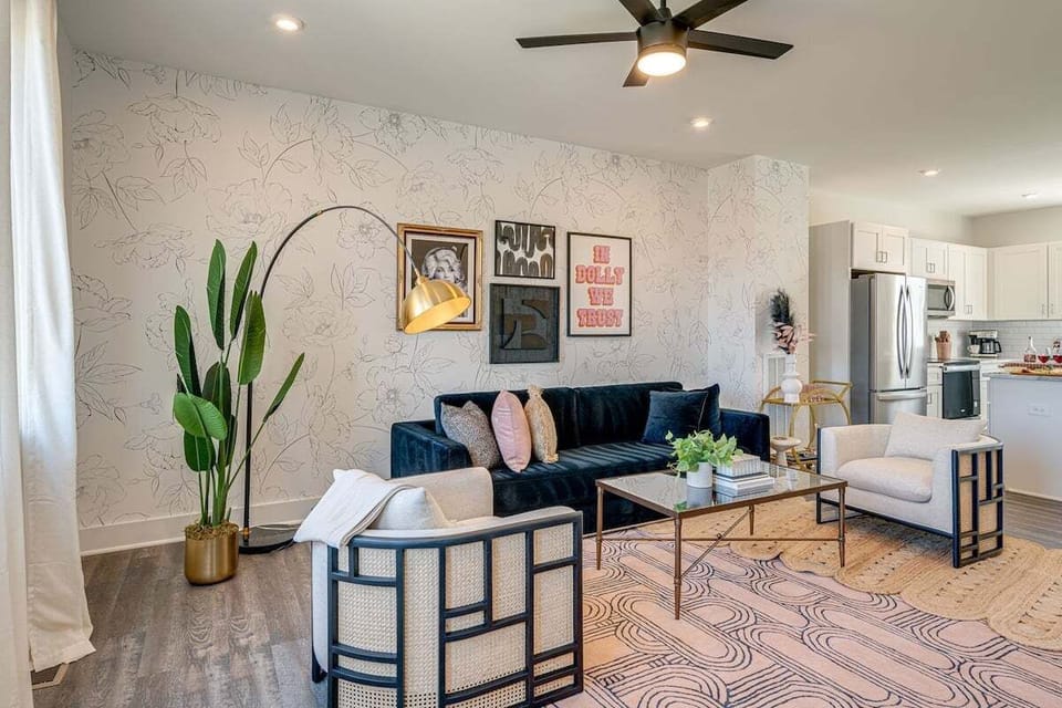 Bright and open living space complete with designer furnishings and smart TV.