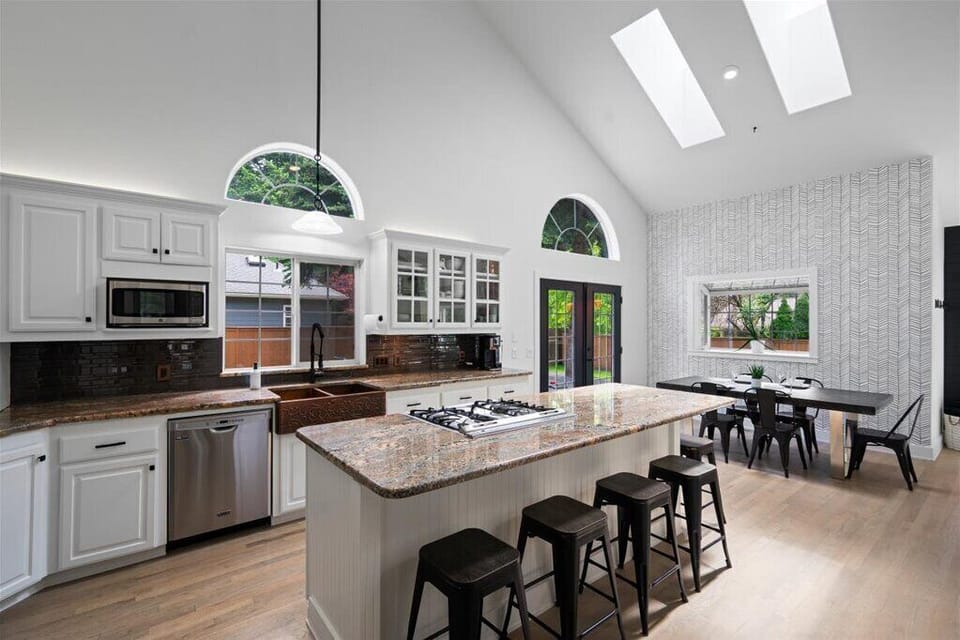 Large kitchen island with 6 bar stools, dishwasher, micro, air fryer, toaster. 