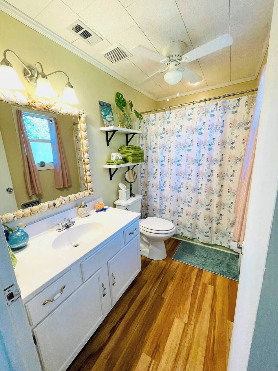 This bathroom includes a tub for an evening soak or bubbles for the littles!