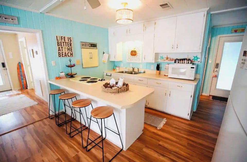 Seating for 4 is available at the kitchen countertop.