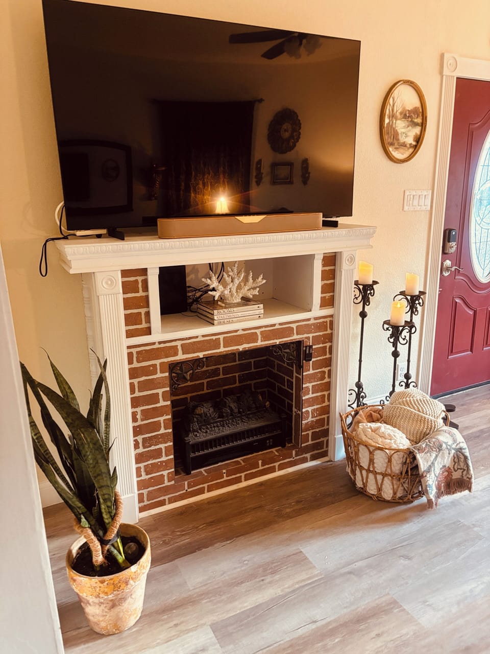 Smart TV with Apple TV sound bar and cozy electric fireplace.