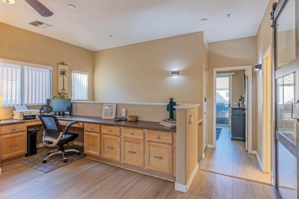 Dedicated space for remote work is adjacent to the kitchen.