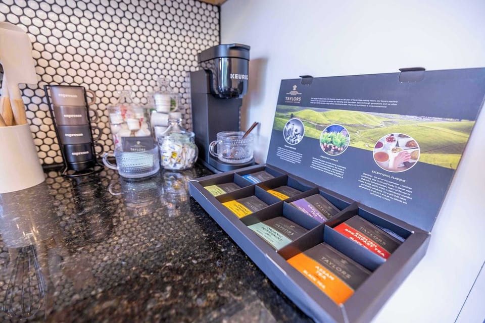 Jumpstart your morning or unwind after a day of exploring with our dedicated coffee and tea station. Equipped with a Keurig coffee maker, an assortment of Nespresso capsules, and a variety of fine teas, this nook caters to all your caffeine needs.