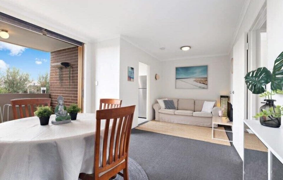 Spacious open-plan living, well-lit with a balcony overseeing the Creek. 
