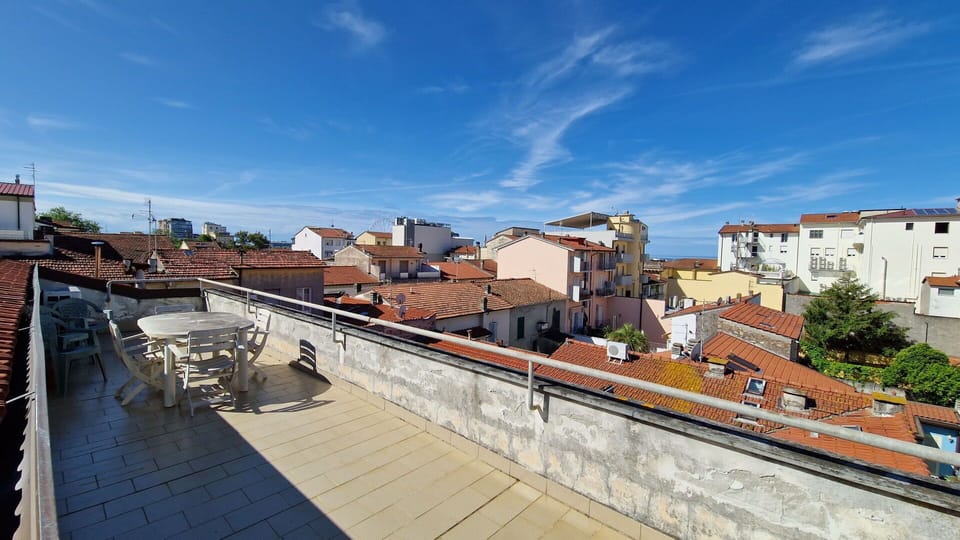 Large terrace overlooking the sea just a few meters from the beach.
