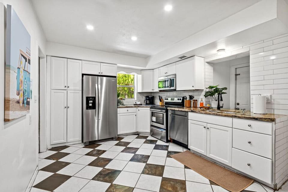 This spacious kitchen is fully equipped with modern appliances and plenty of counter space.