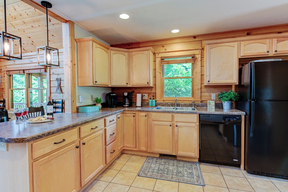 Keurig and coffee maker with coffee, pods, creamer and sugar provided. 