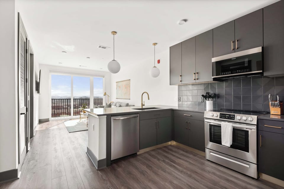 Fully Stocked Kitchen with Modern Appliances and Ample Storage
