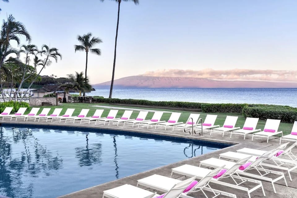 Slip into the sparkling pool with endless ocean views.