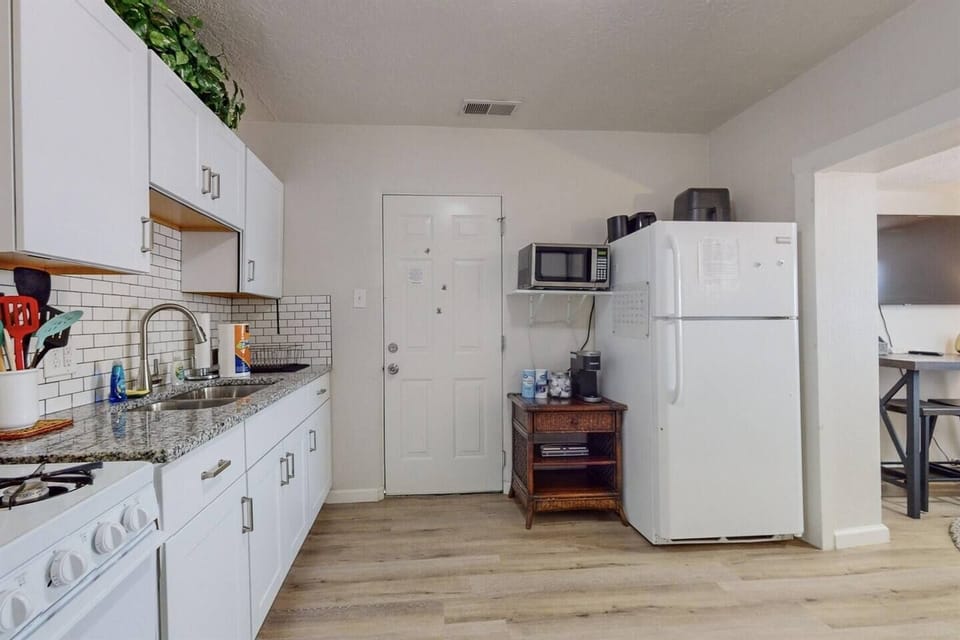 Entrance into home with full kitchen