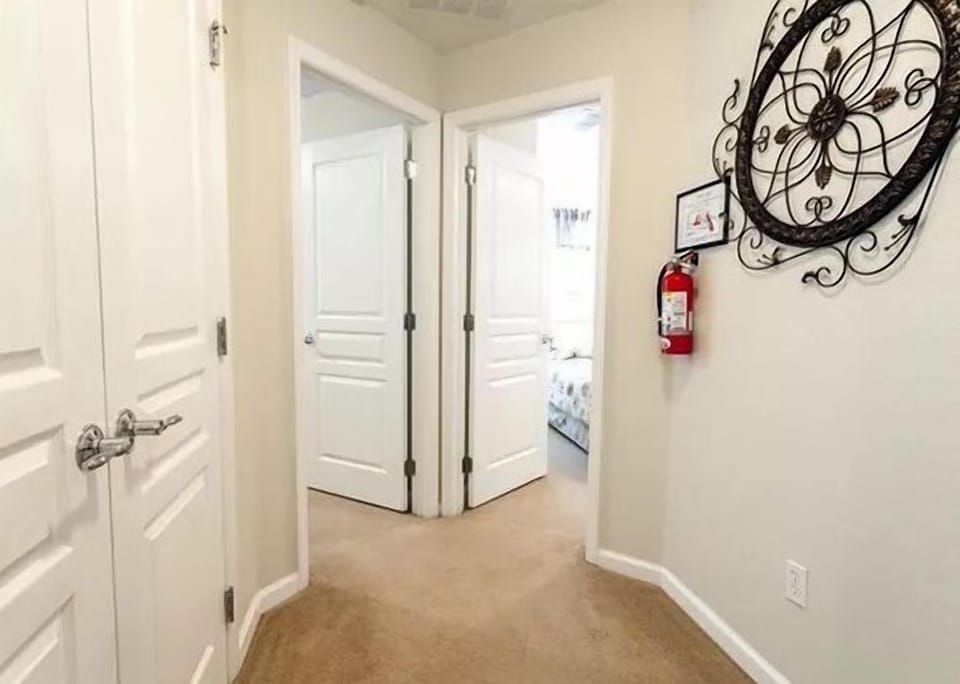 Bright hallway leading to bedrooms, adding a welcoming touch to your stay.