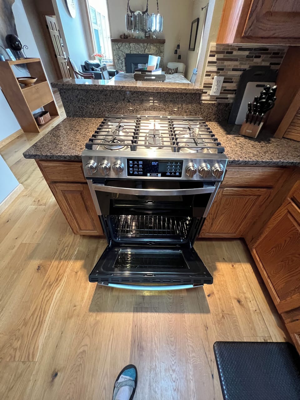 New clean gas stove and double ovens in open concept.