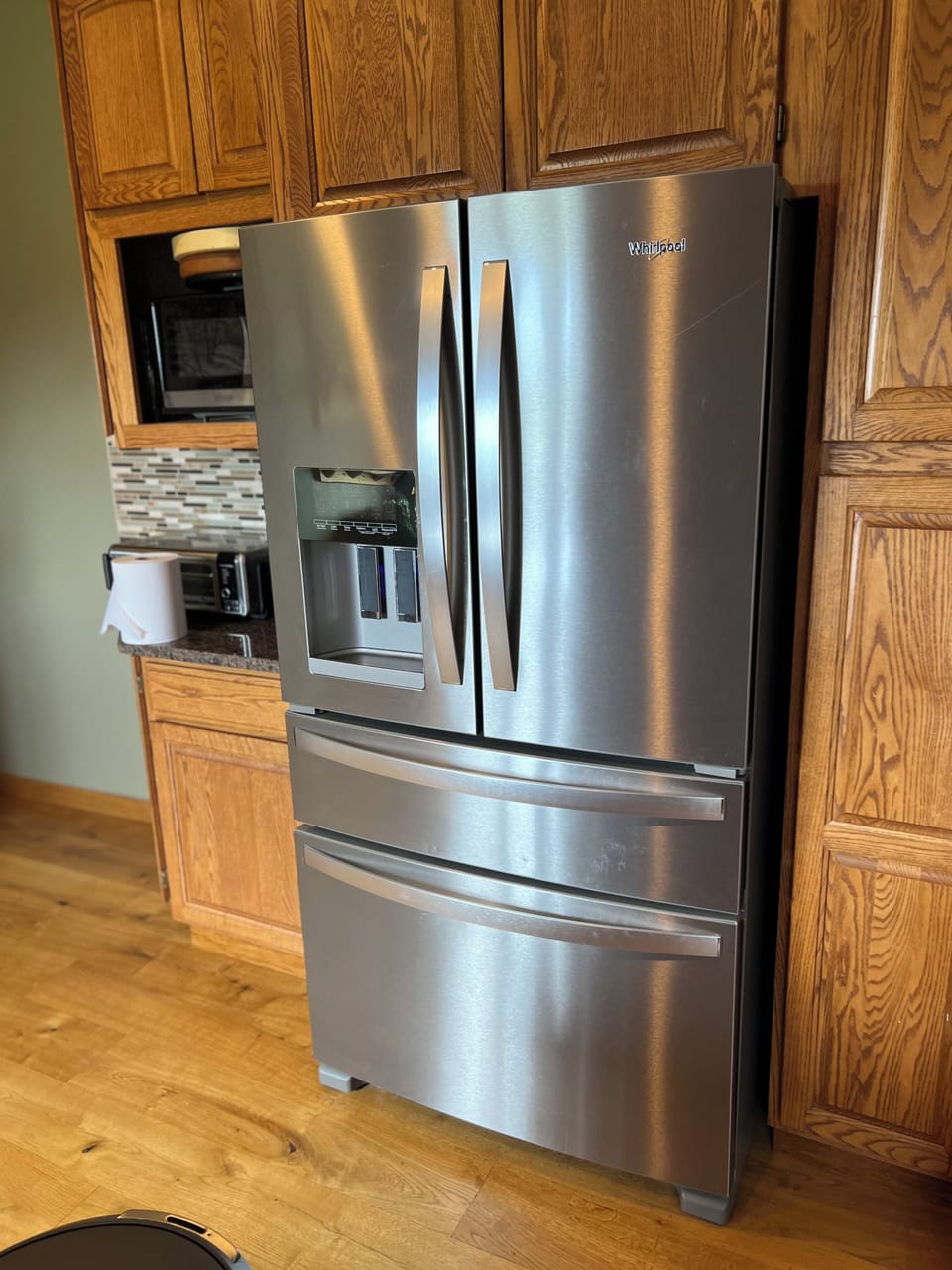 Large new fridge, microwave and toaster oven.
