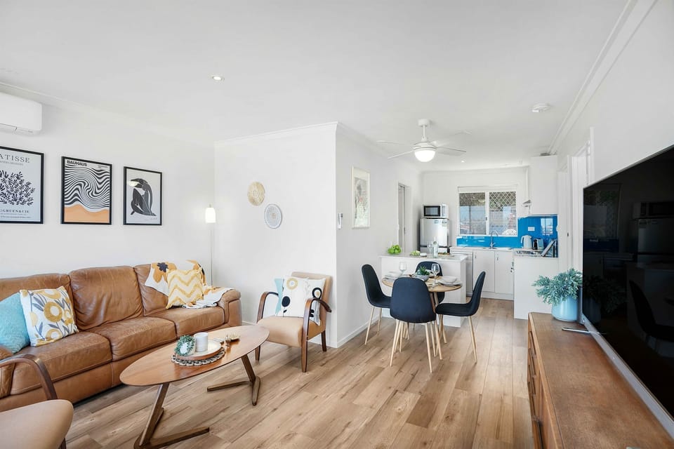 Spacious lounge and dining flowing into the kitchen.