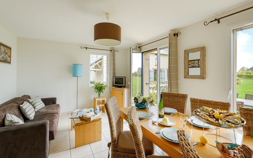 Loads of room at the dining table and the open concept is always nice for the cook.