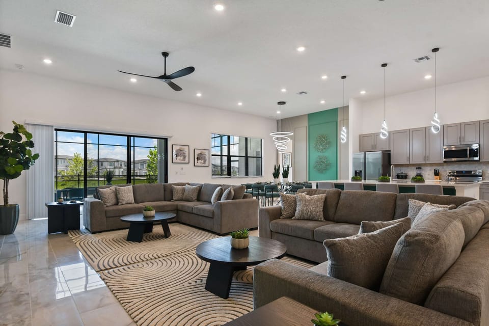 Gather in the spacious living room with plush sofas and a large flat - screen TV.