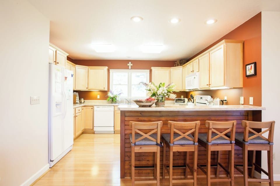 Kitchen includes modern appliances and ample counter space.