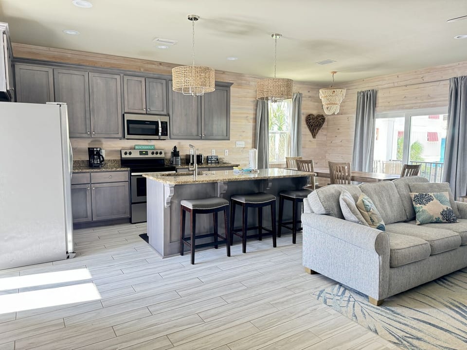 This home has an open floor plan that connects the living room, dining room, and kitchen.